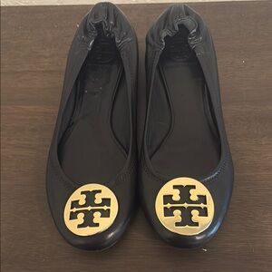 Tory Burch Black and Gold Loafers with Logo Medallion